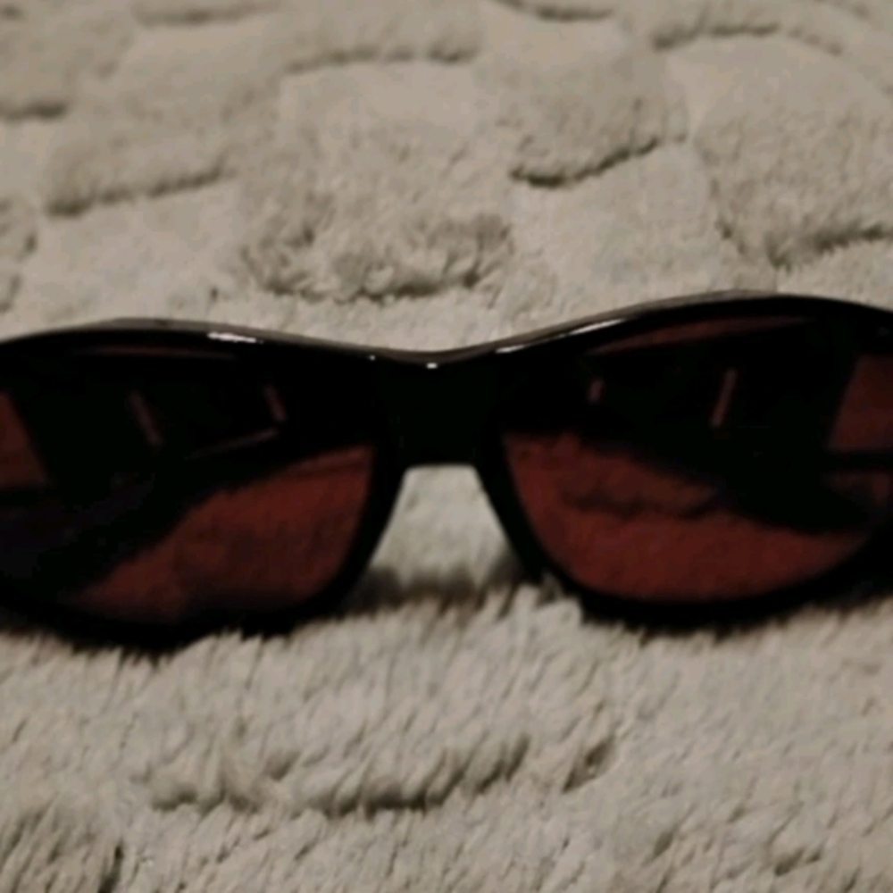 Stylish Black Sunglasses with Red Lenses